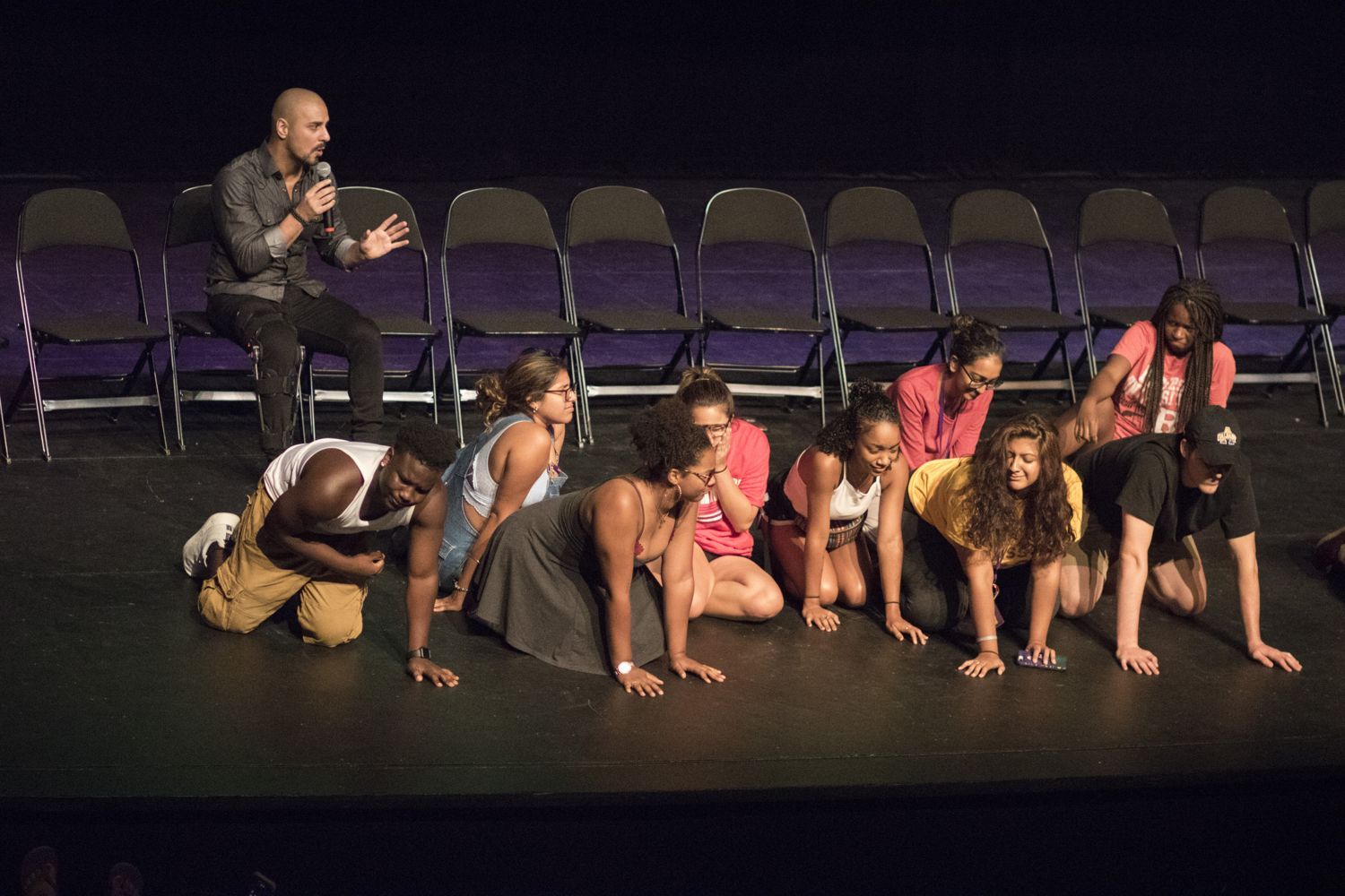 Volunteers on stage during Eric Mina's hypnosis show