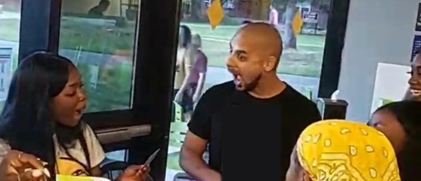 A guest reacts as Eric Mina reveals her card