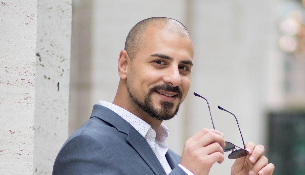 Eric Mina at a corporate reception
